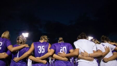 Central Arkansas players huddle together before the start of Thursday night's game against Little Rock University.