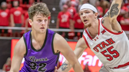 UCA's Layne Taylor drives against the Utah Utes