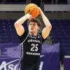 Bears forward Elias Cato puts up a shot against Lipscomb