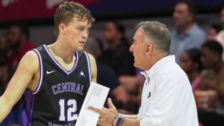 UCA Bears Ty Robinson talks with coach John Shulman during game against the SMU Mustangs