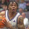 UCA Bears guard Camren Hunter drives against Queens