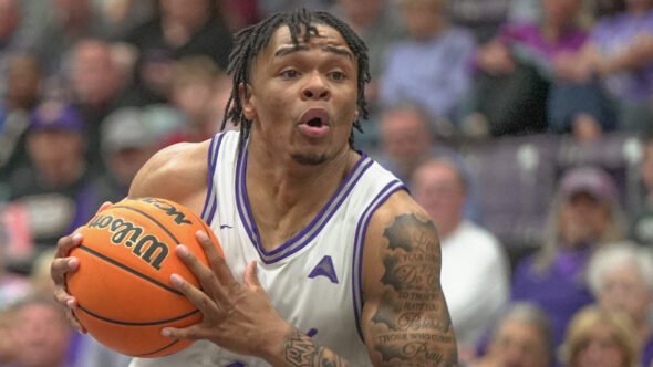 UCA Bears guard Camren Hunter drives against Queens