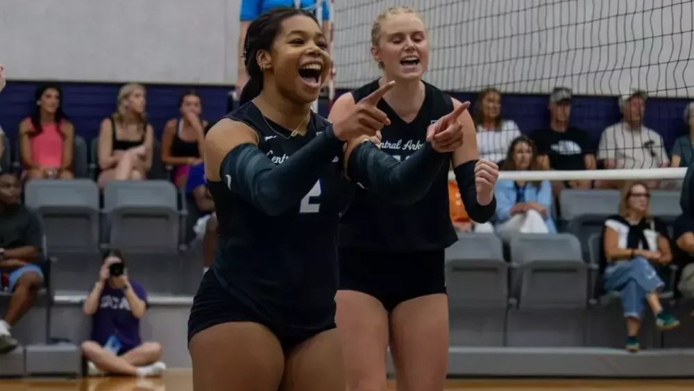 UCA volleyball players during match against Denver.